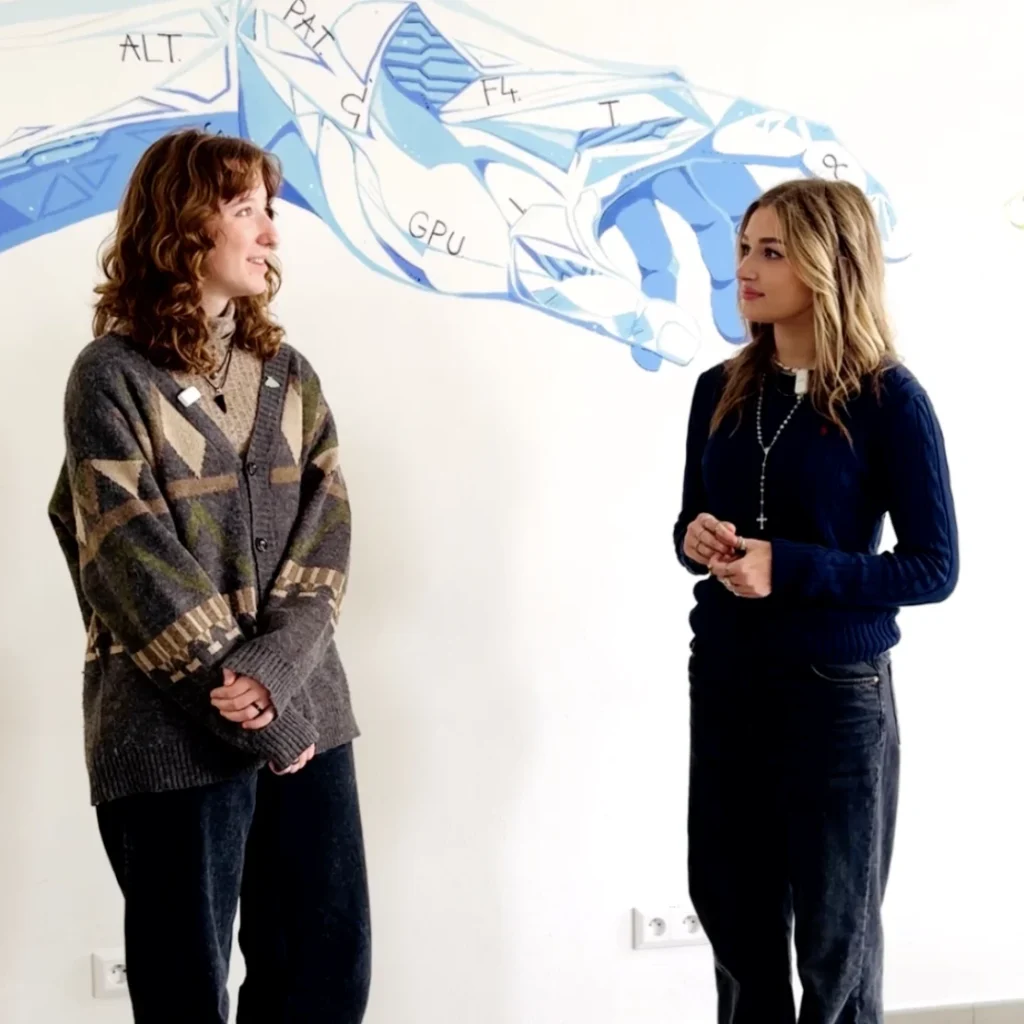 An interview with Eliška in front of a school mural.