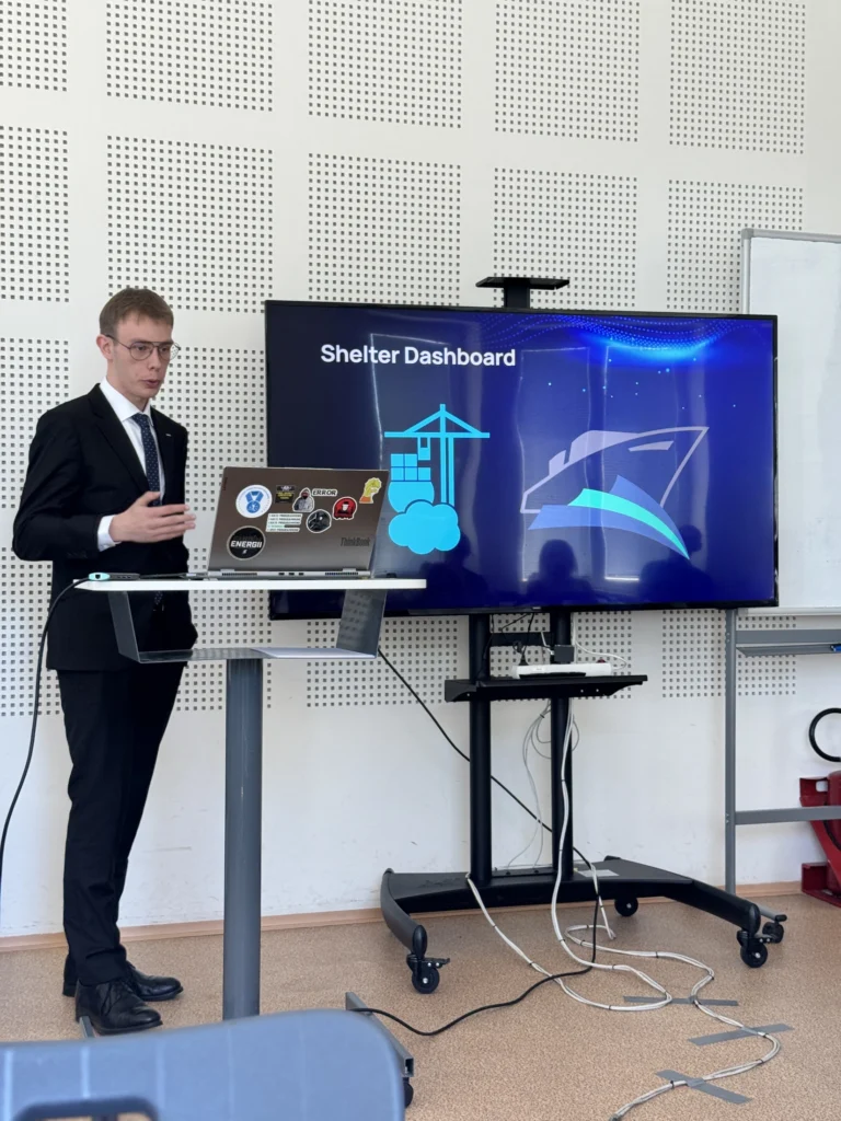 A student presenting his project on a screen
